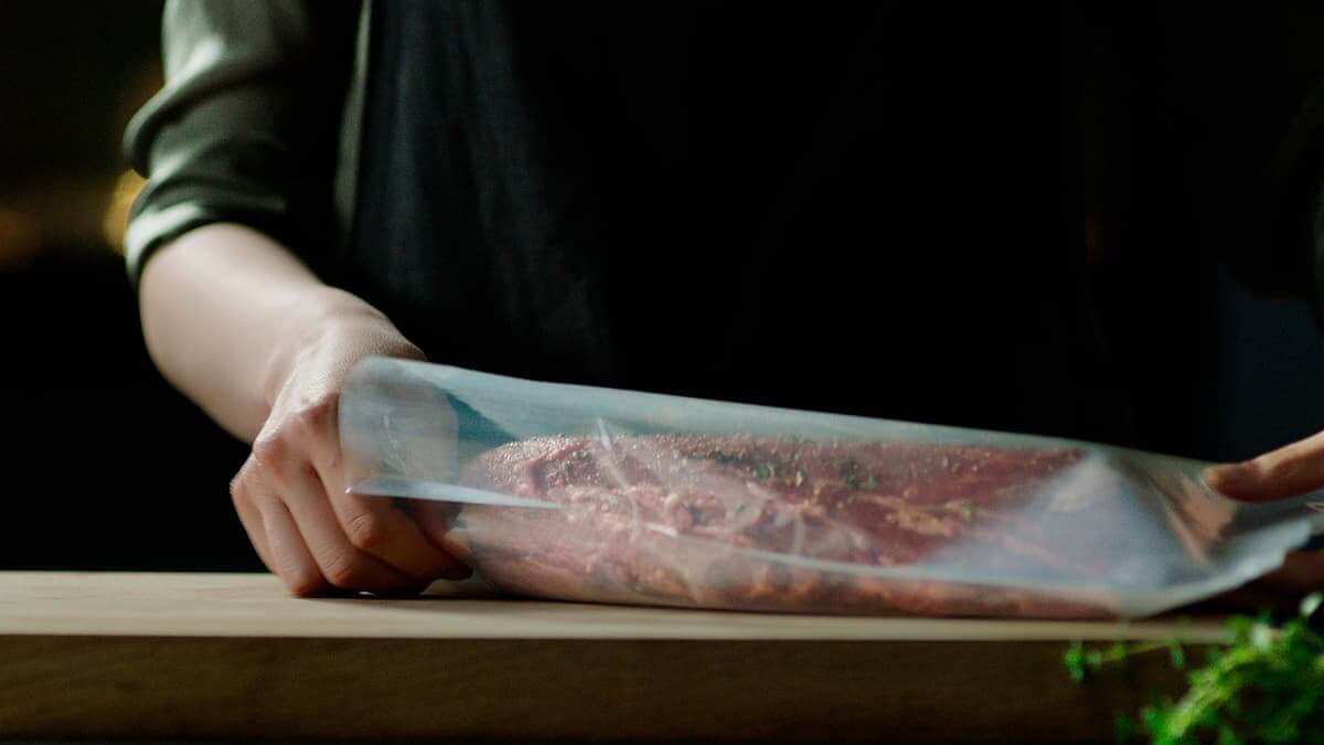 Vacuum seal drawer removing air from food packaging to preserve freshness and texture