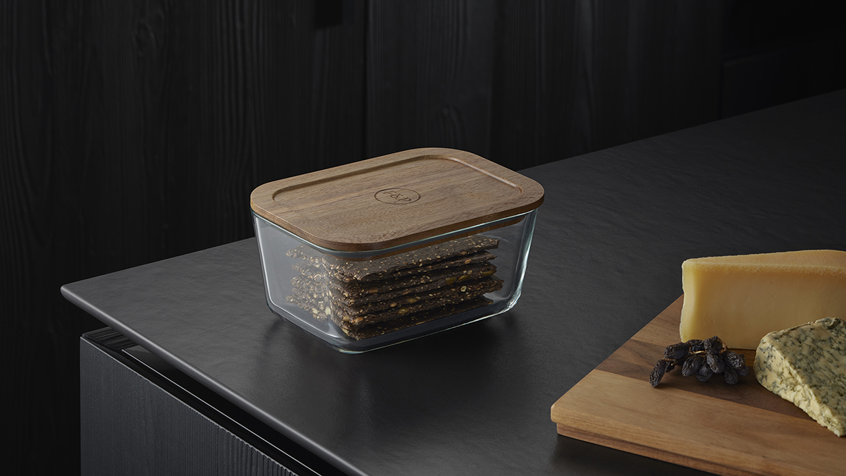 Food storage container with wooden lid and stored crackers